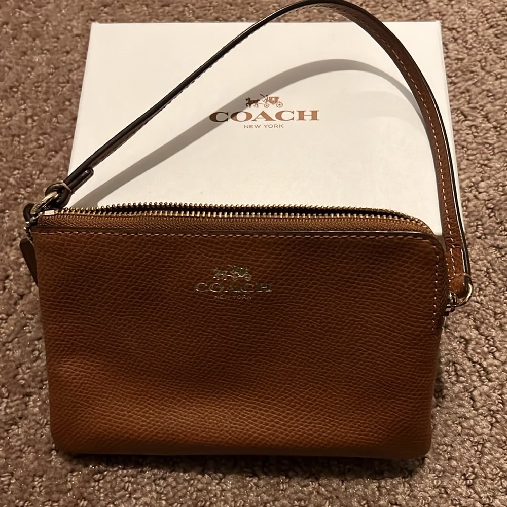 Small Camel color Coach leather wristlet.